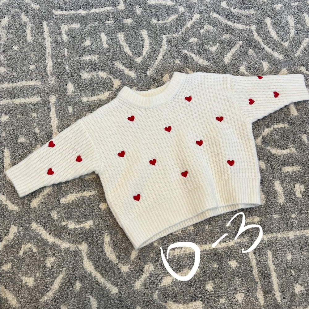 White Sweater with Red Heart Accents